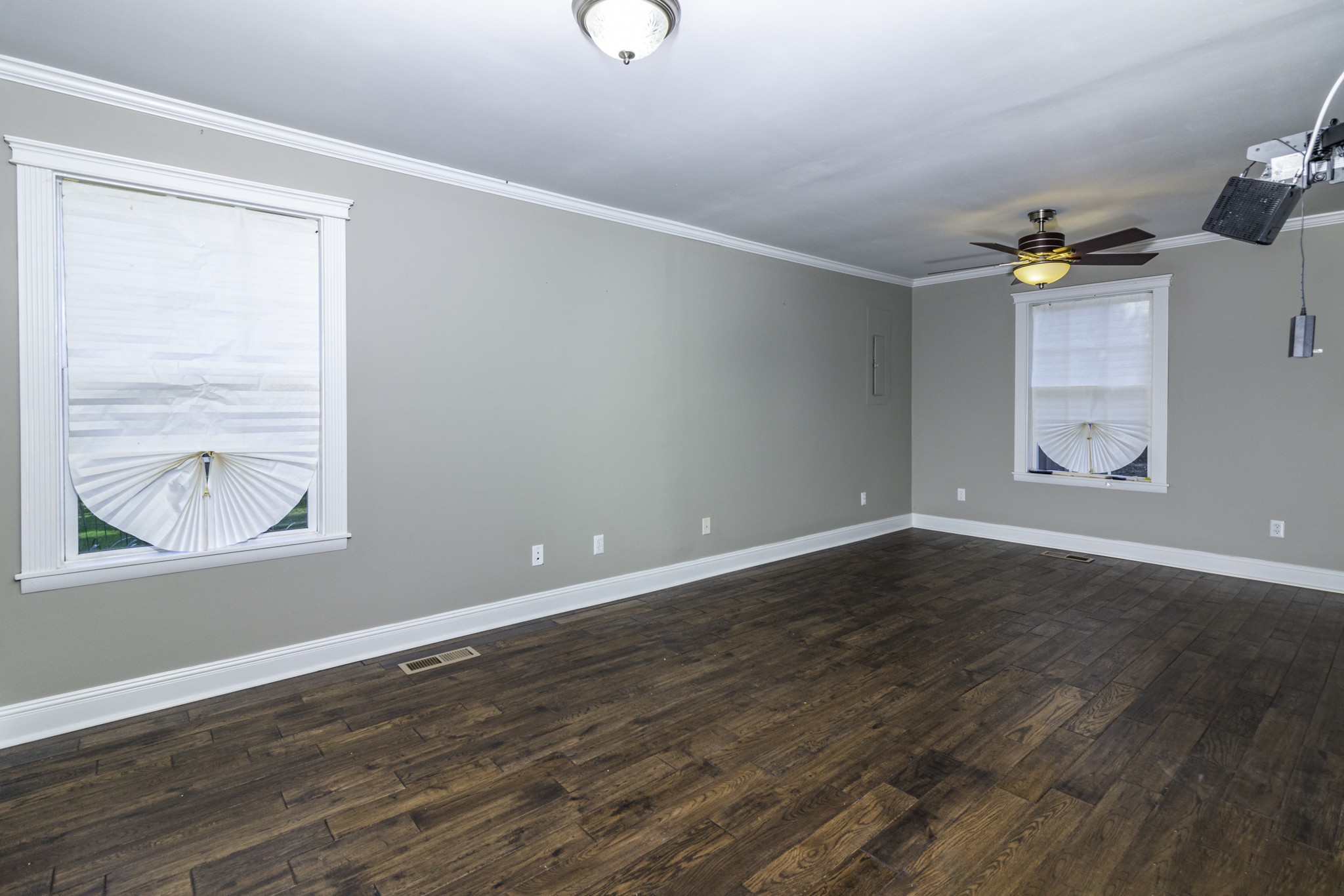 525 York Hollow Road Pulaski, TN 38478 - Photo 11 of 48 an empty room with wooden floor and windows