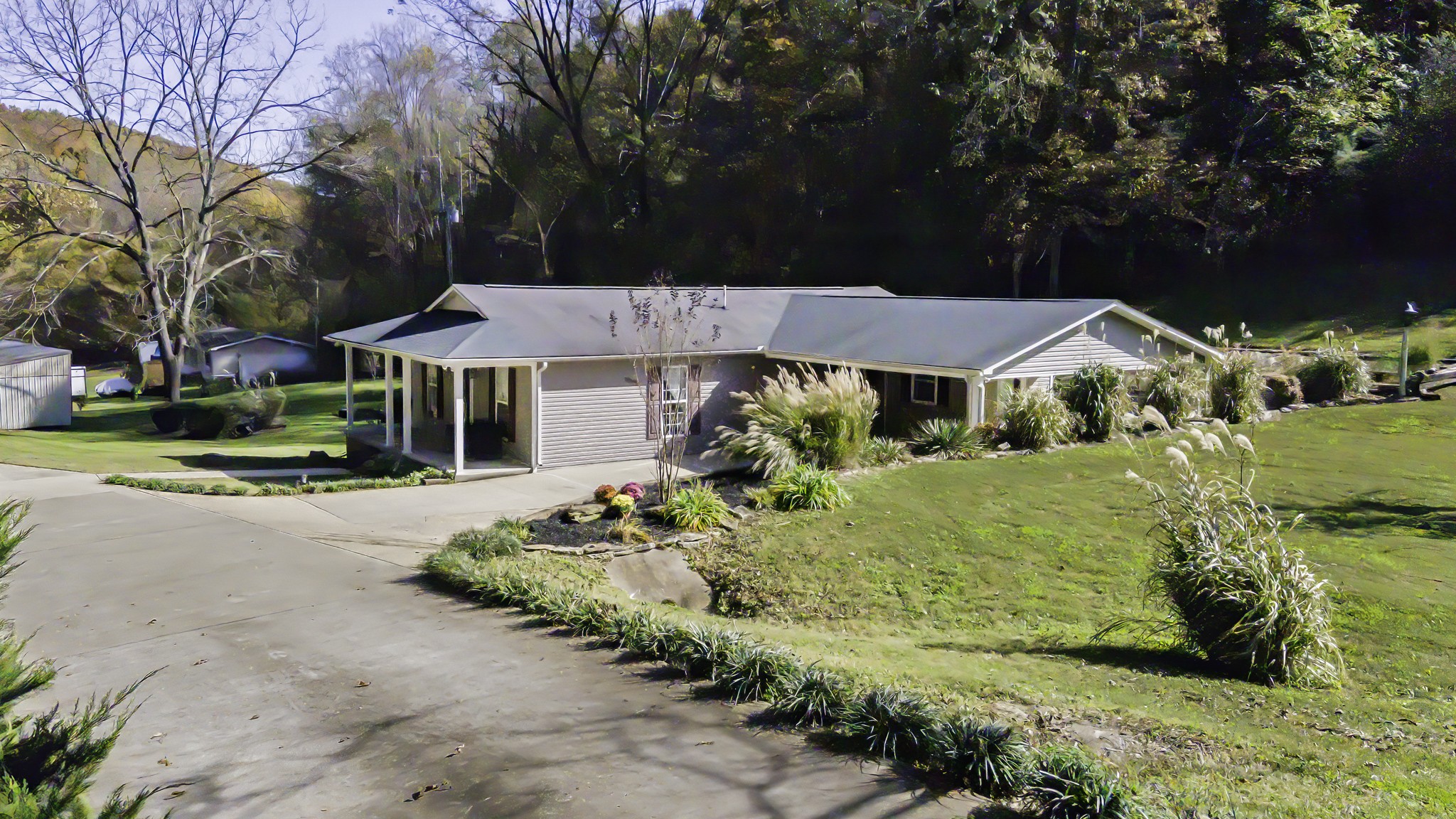 525 York Hollow Road Pulaski, TN 38478 - Photo 33 of 48 a view of a white house with a big yard and large trees