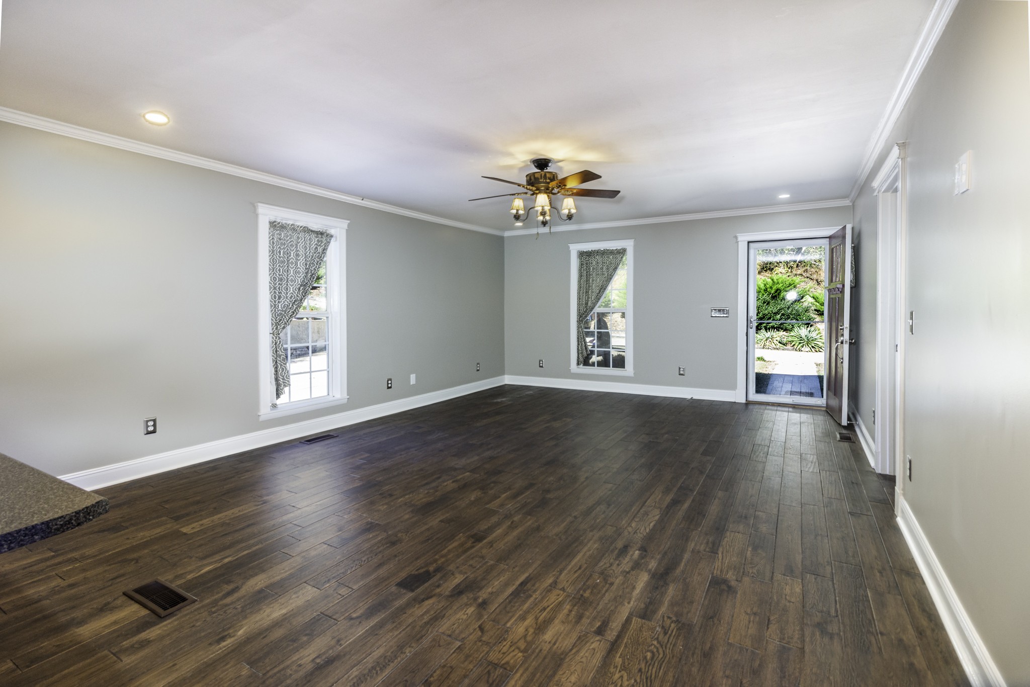 525 York Hollow Road Pulaski, TN 38478 - Photo 5 of 48 an empty room with wooden floor and windows