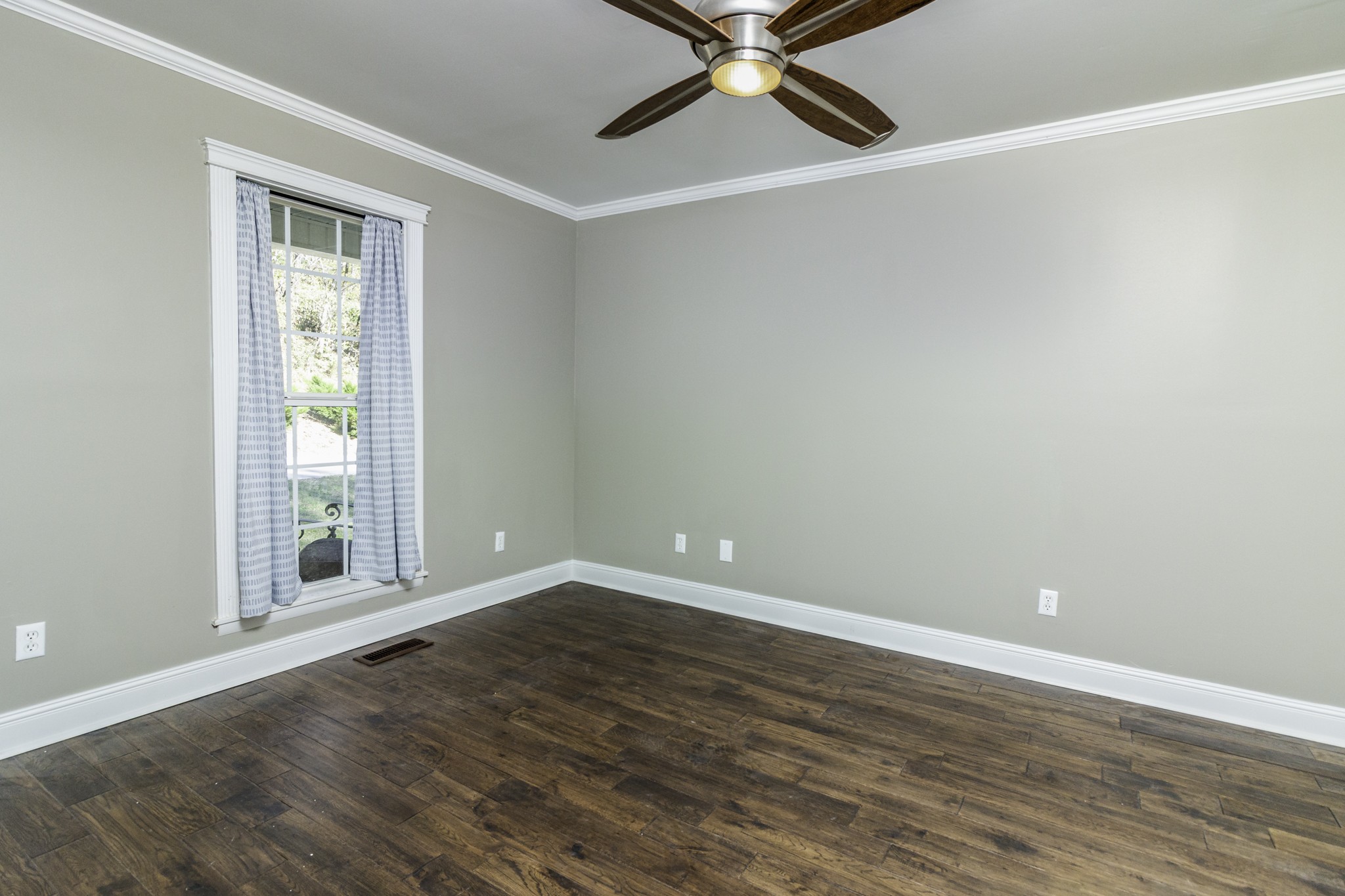 525 York Hollow Road Pulaski, TN 38478 - Photo 9 of 48 a view of an empty room with wooden floor and a window