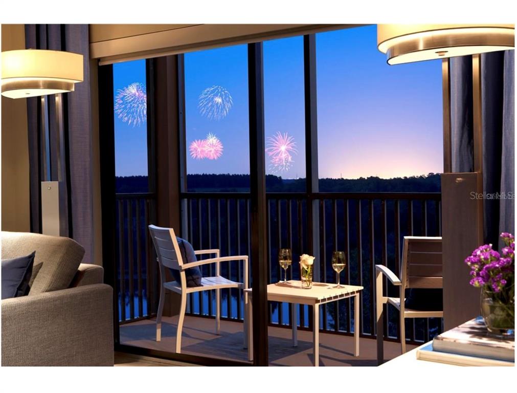 14501 Grove Resort Avenue, Unit 1237 Winter Garden, FL 34787 - Photo 5 of 7 a dining room with furniture and chandelier