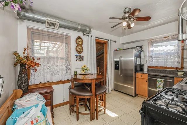 a bathroom with a sink mirror and shower