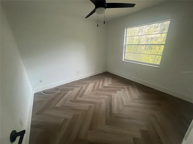 a view of an empty room and window