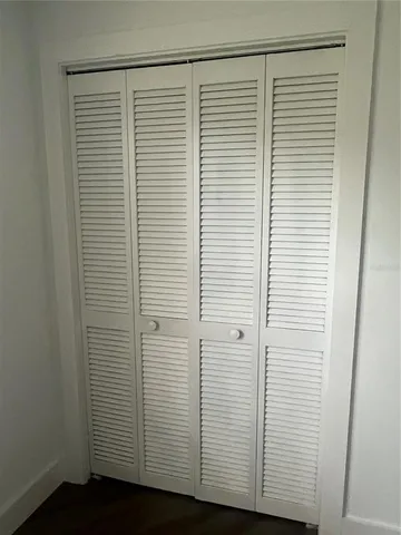 a view of a room with a wooden floor