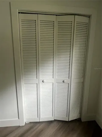 an empty room with wooden floor