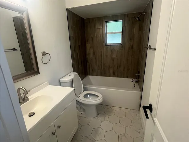 a bathroom with a sink a toilet and a bathtub