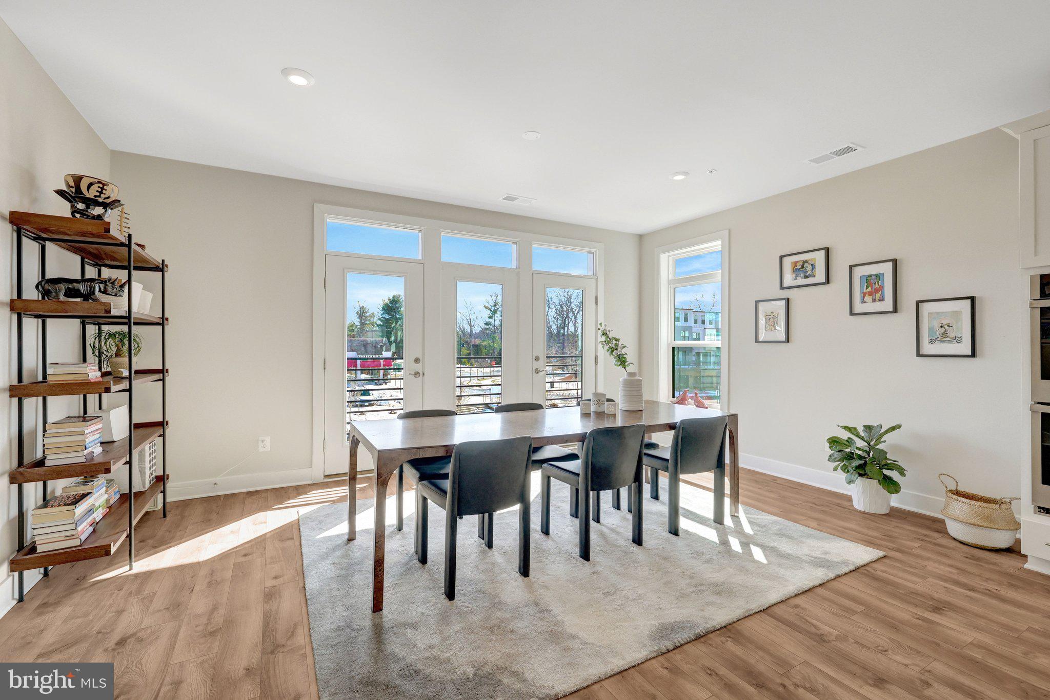 1694 Bandit Loop, Unit 17B Reston, VA 20190 - Photo 13 of 46 a view of a a dining room with furniture window and wooden floor