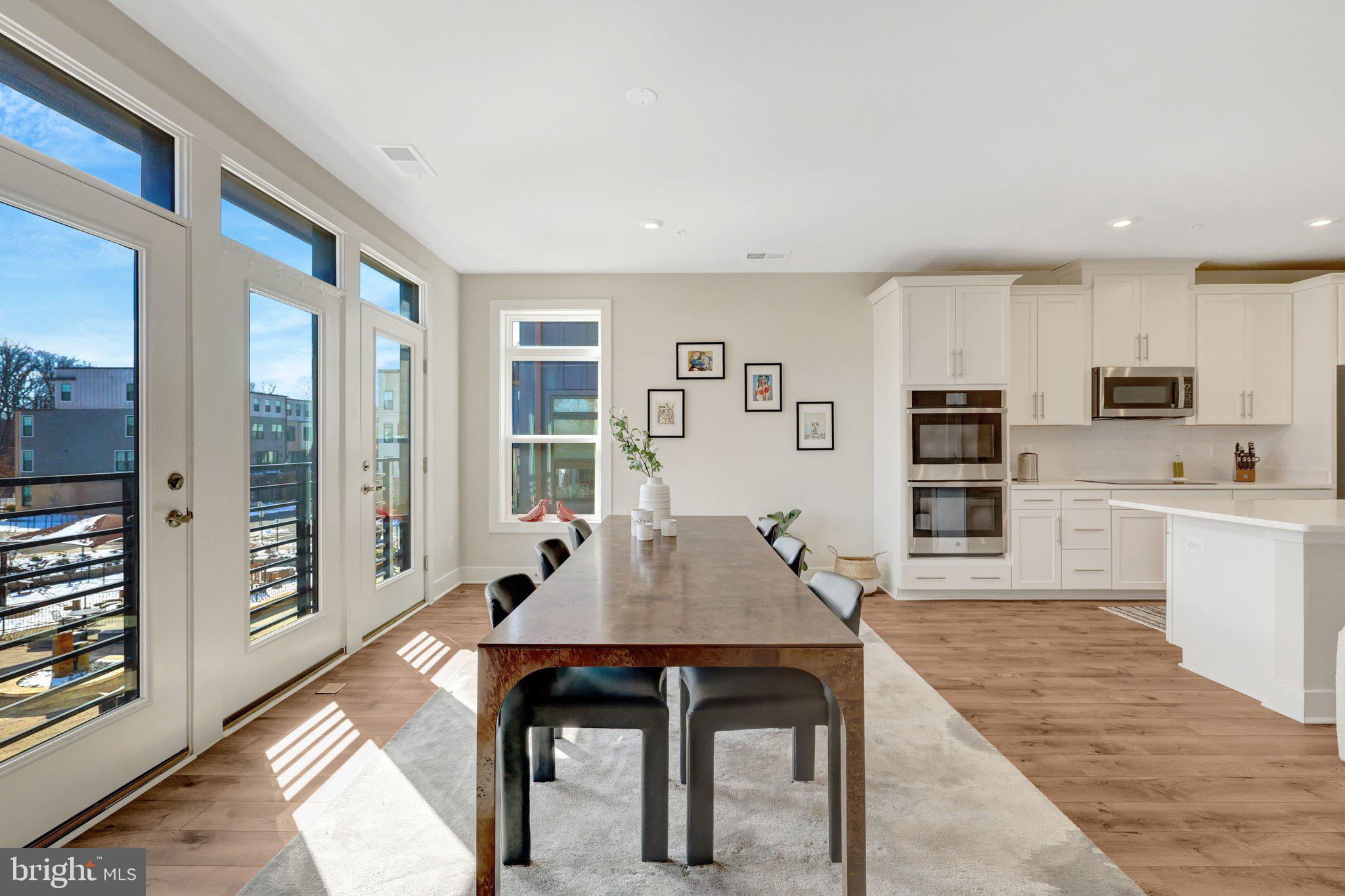1694 Bandit Loop, Unit 17B Reston, VA 20190 - Photo 14 of 46 a view of a dining room with furniture window and wooden floor