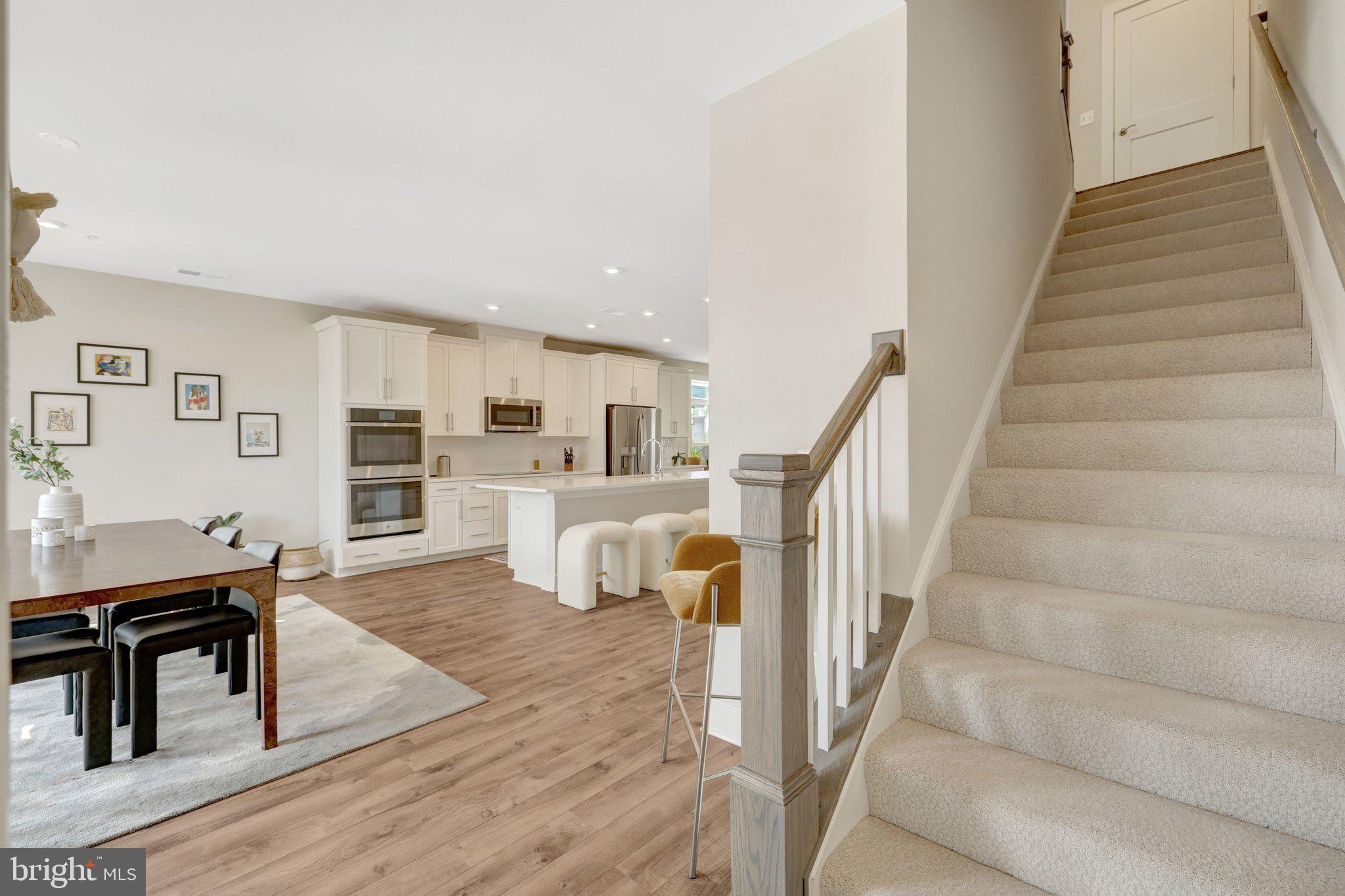 1694 Bandit Loop, Unit 17B Reston, VA 20190 - Photo 18 of 46 a living room with furniture and a wooden floor