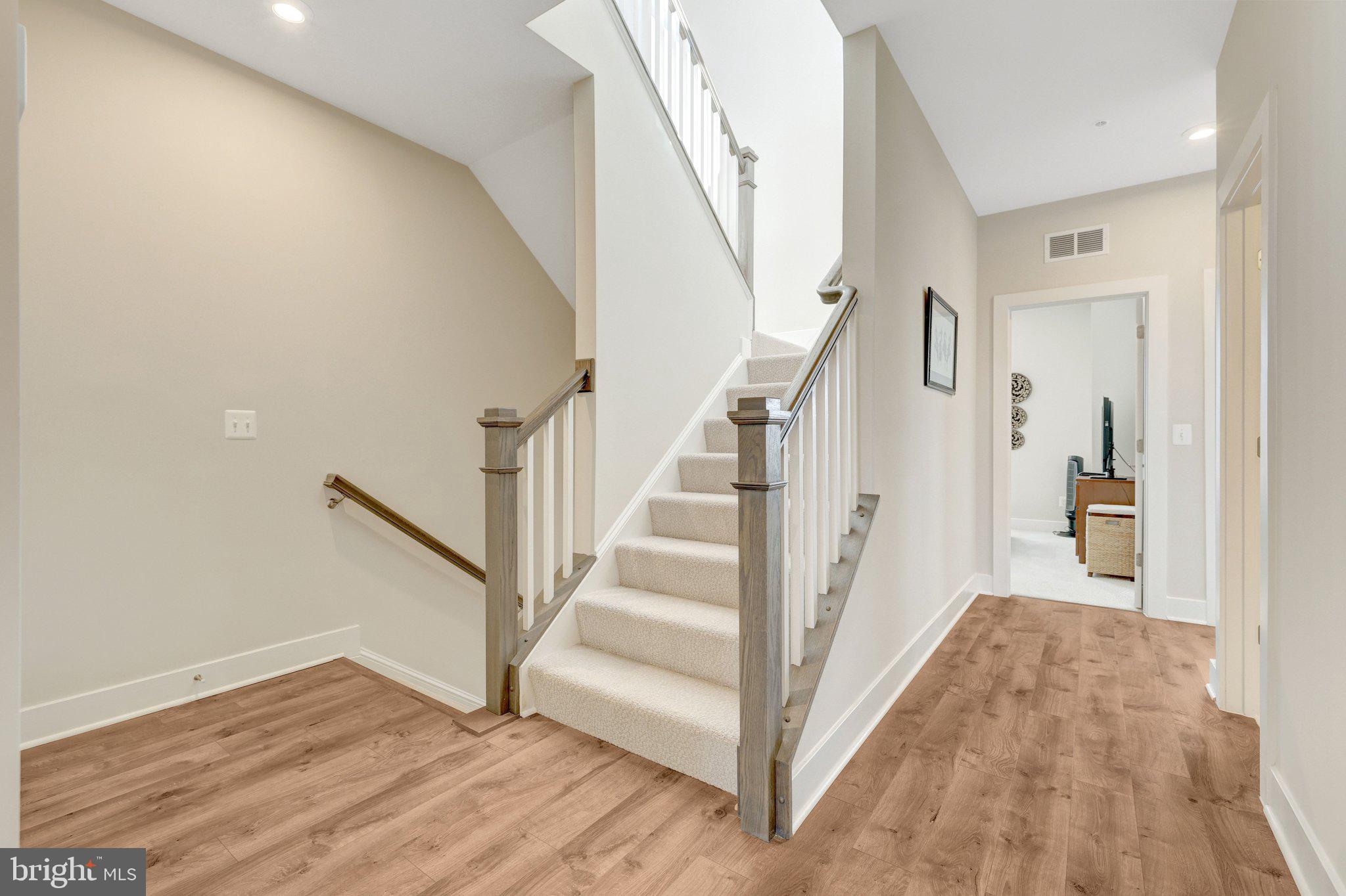 1694 Bandit Loop, Unit 17B Reston, VA 20190 - Photo 19 of 46 a view of entryway and hall with wooden floor
