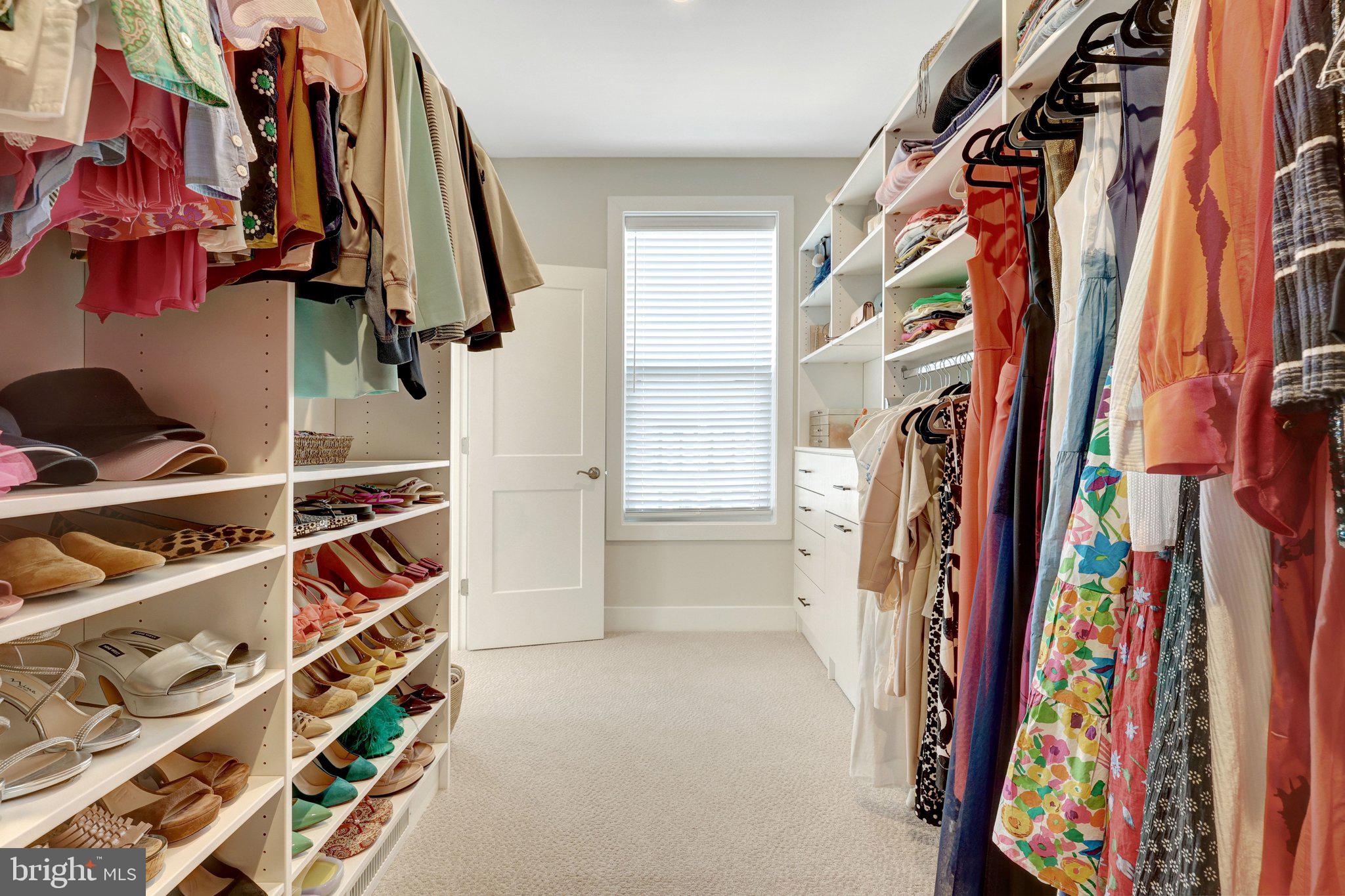 1694 Bandit Loop, Unit 17B Reston, VA 20190 - Photo 23 of 46 a view of walk in closet with clothes and shoes