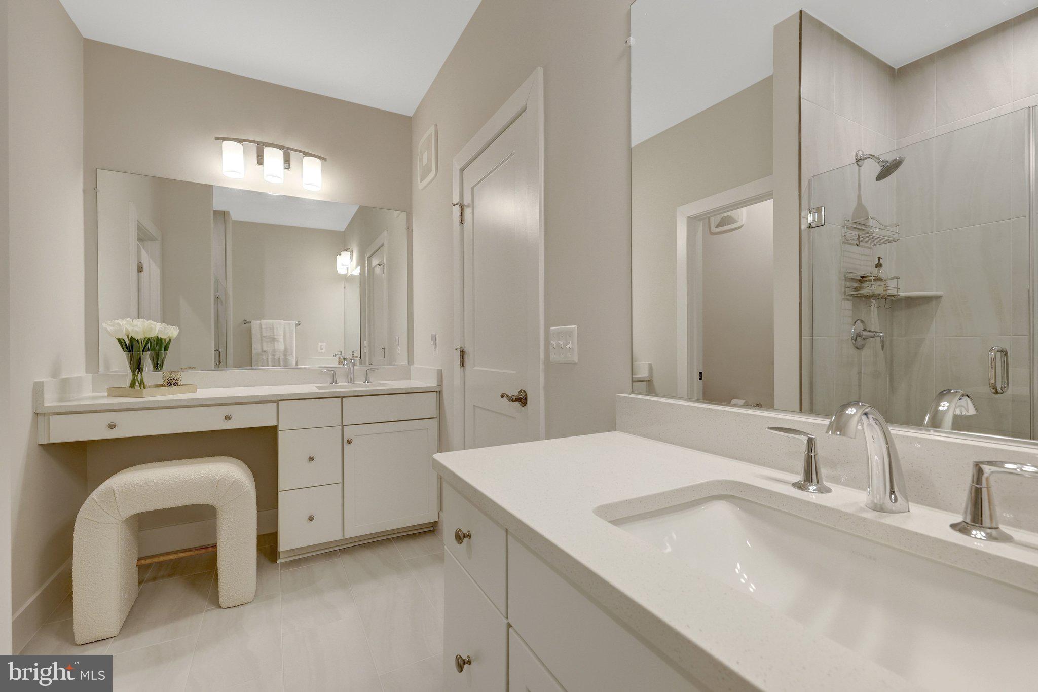1694 Bandit Loop, Unit 17B Reston, VA 20190 - Photo 25 of 46 a bathroom with a sink and a mirror