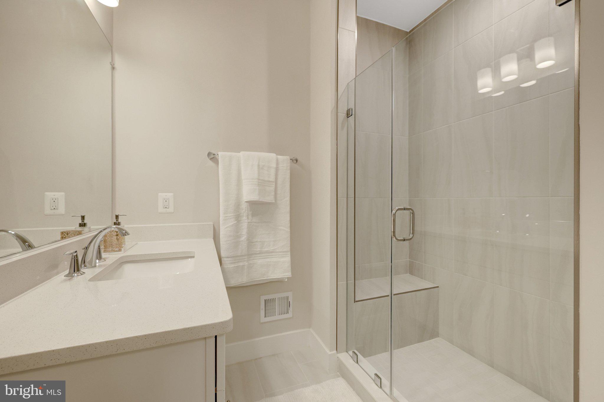 1694 Bandit Loop, Unit 17B Reston, VA 20190 - Photo 26 of 46 a bathroom with a sink and a mirror