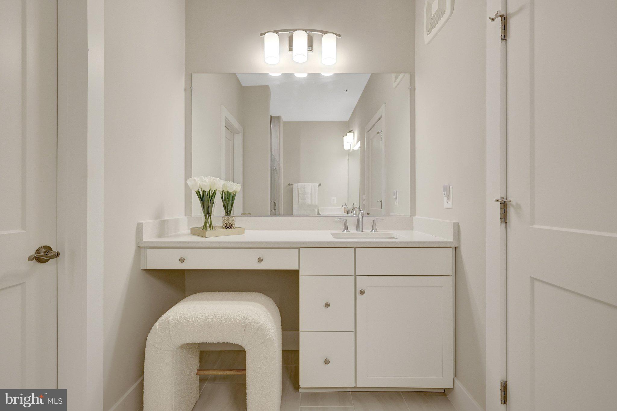 1694 Bandit Loop, Unit 17B Reston, VA 20190 - Photo 28 of 46 a bathroom with a sink vanity granite and a mirror