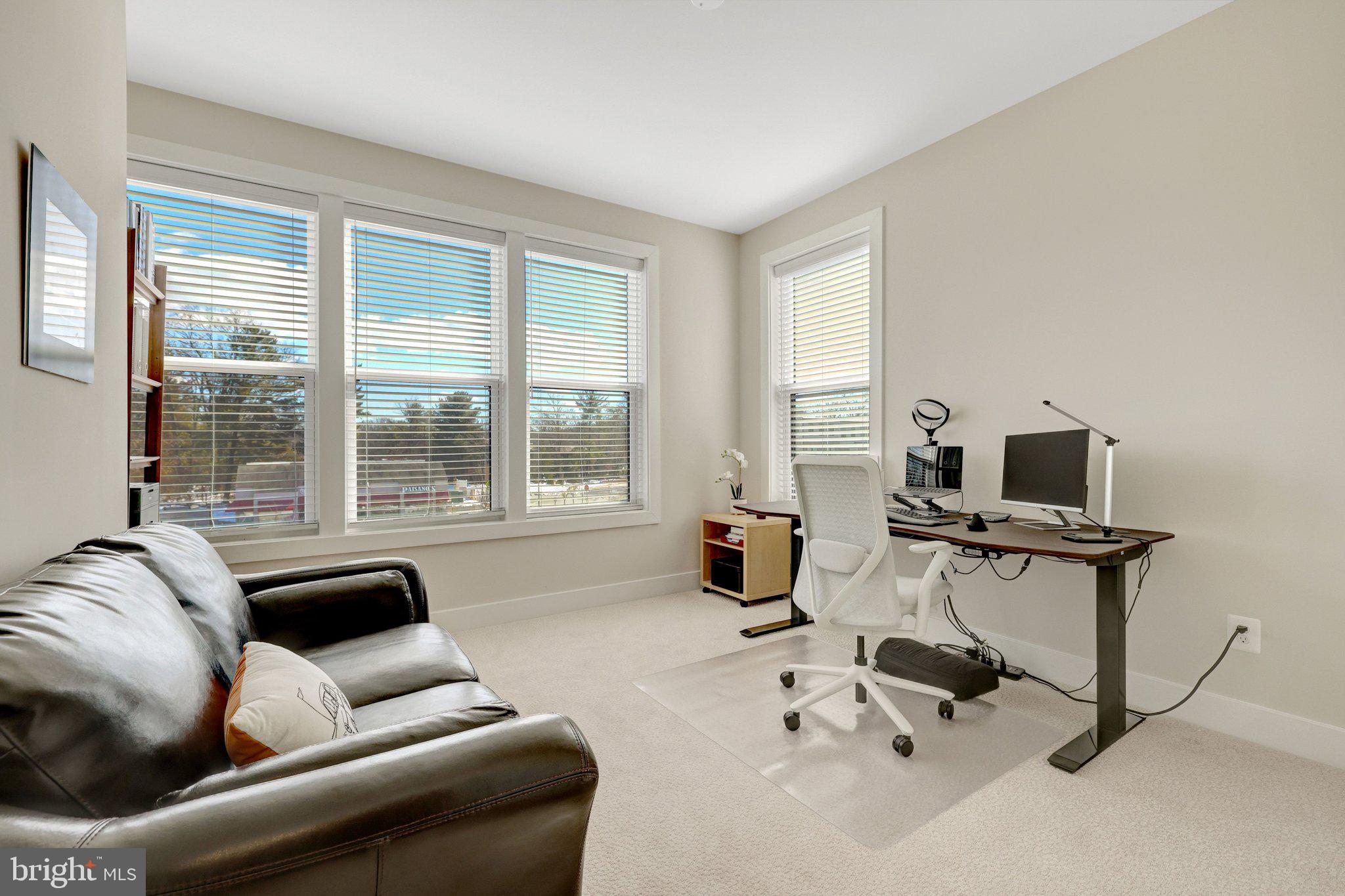 1694 Bandit Loop, Unit 17B Reston, VA 20190 - Photo 31 of 46 a living room with furniture and a flat screen tv