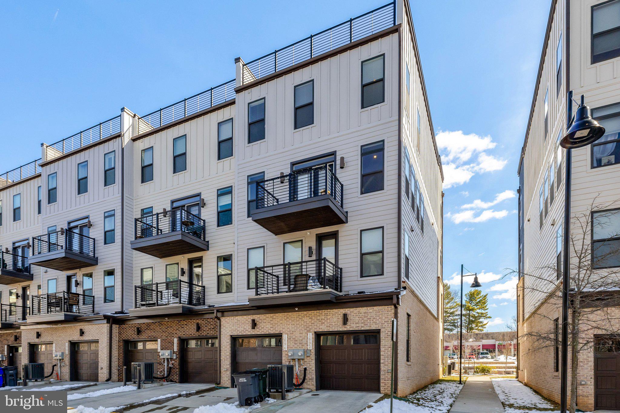 1694 Bandit Loop, Unit 17B Reston, VA 20190 - Photo 44 of 46 a front view of a building with street view