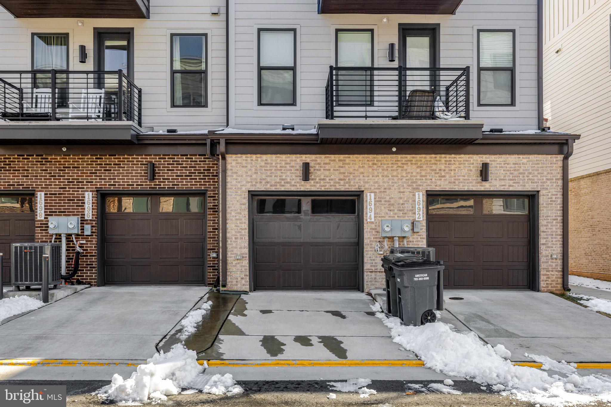 1694 Bandit Loop, Unit 17B Reston, VA 20190 - Photo 45 of 46 a front view of a house with barbeque area