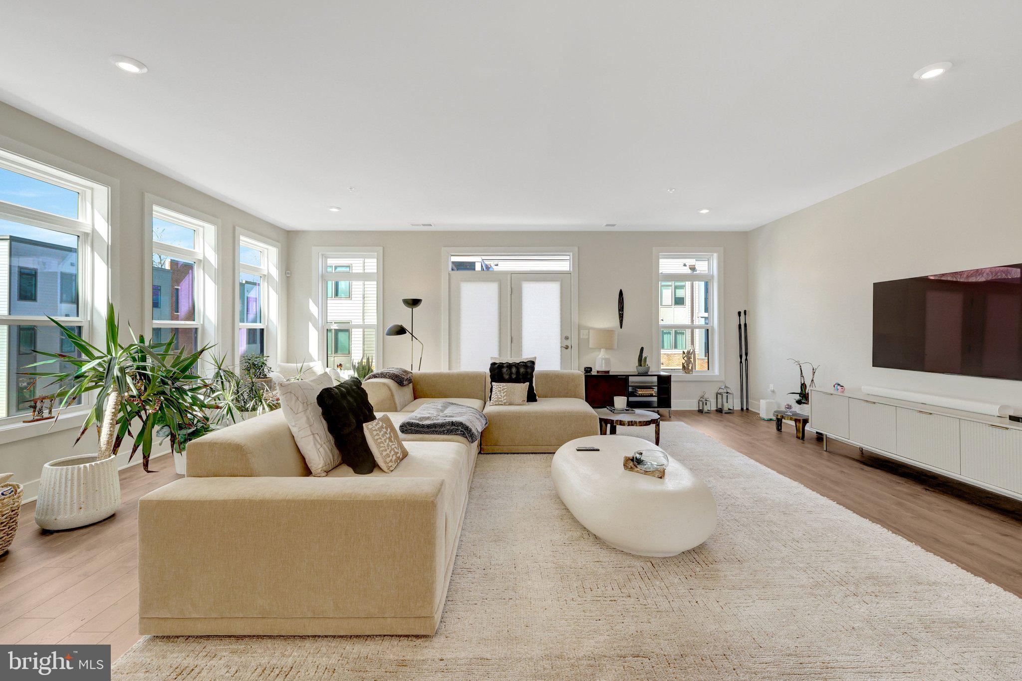 1694 Bandit Loop, Unit 17B Reston, VA 20190 - Photo 9 of 46 a living room with furniture and a flat screen tv