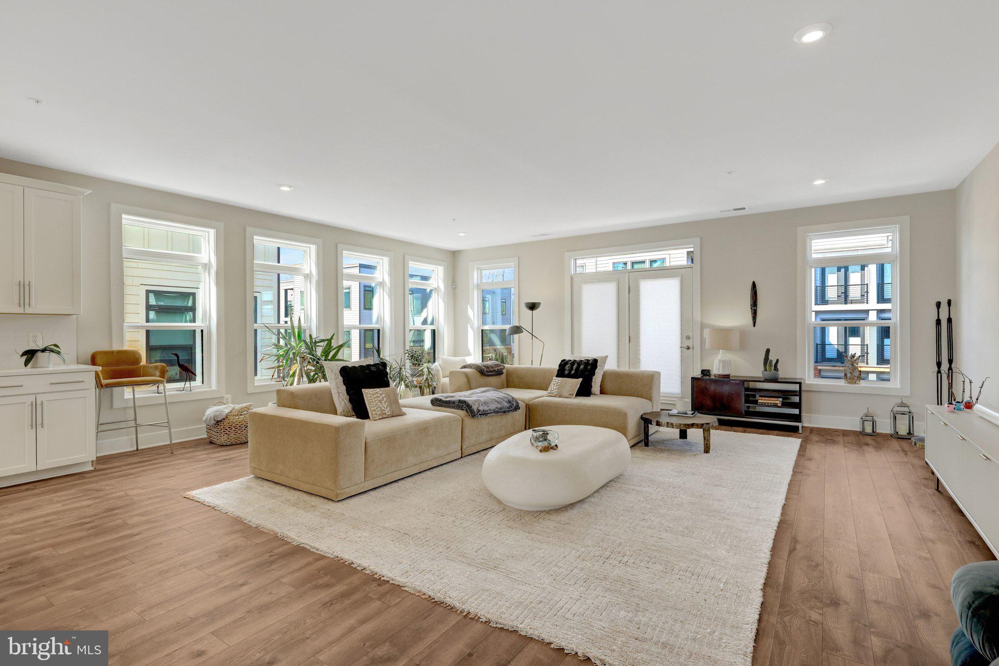1694 Bandit Loop, Unit 17B Reston, VA 20190 - Photo 10 of 46 a living room with furniture and large windows