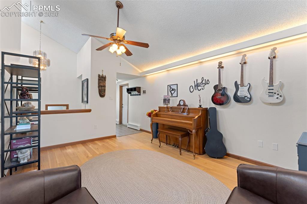 1851 Buttercup Road Elizabeth, CO 80107 - Photo 5 of 47 a living room with furniture a rug and a window