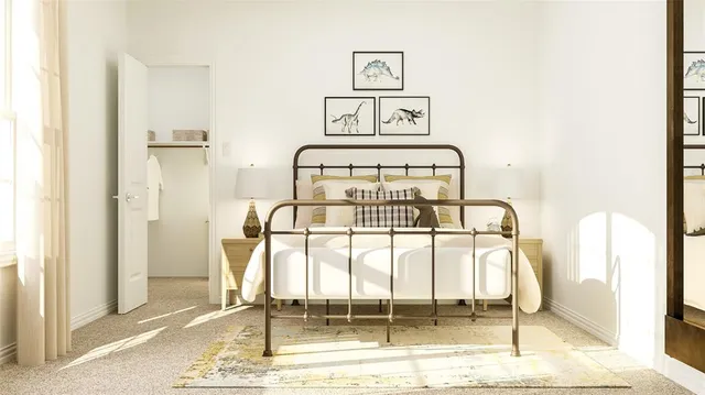 a bedroom with a bed and a mirror