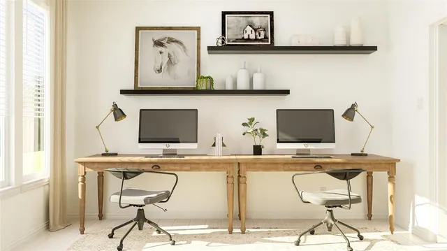 a view of a workspace with furniture and wooden floor