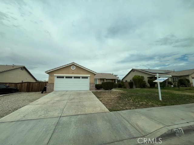15177 Braxton Street Adelanto, CA 92301 - Photo 1 of 34 a house with a yard