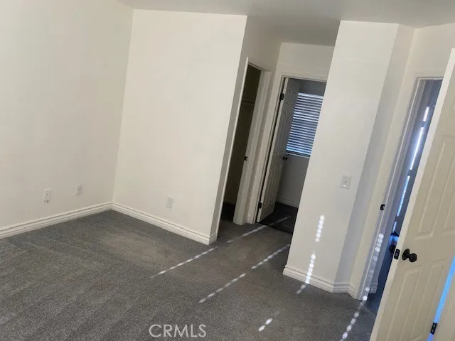 an empty room with a mirror