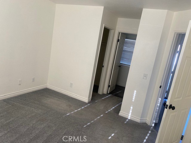 15177 Braxton Street Adelanto, CA 92301 - Photo 14 of 34 an empty room with a mirror