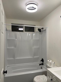 15177 Braxton Street Adelanto, CA 92301 - Photo 19 of 34 a bathroom with a tub and a shower