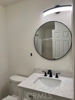 15177 Braxton Street Adelanto, CA 92301 - Photo 20 of 34 a bathroom with a sink and mirror