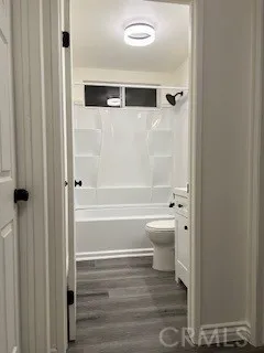 a bathroom with a shower and a toilet