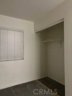 a view of an empty room and a window