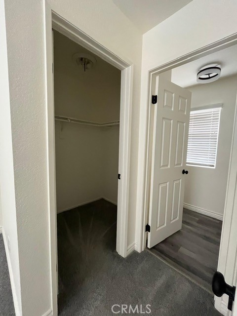 15177 Braxton Street Adelanto, CA 92301 - Photo 4 of 34 a view of a hallway with wooden floor and closet area