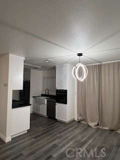 15177 Braxton Street Adelanto, CA 92301 - Photo 8 of 34 a kitchen with granite countertop a stove and a refrigerator