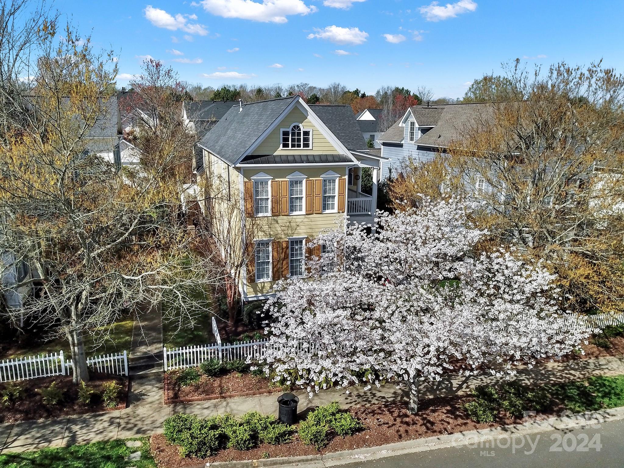 724 Shady Grove Crossing Fort Mill, SC 29708 - Photo 1 of 48 a view of a big house with a big yard and large trees