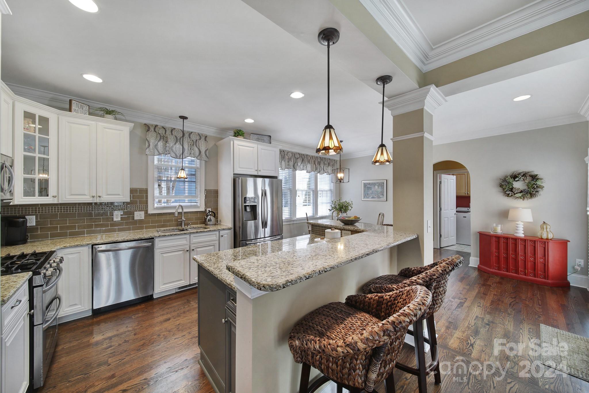 724 Shady Grove Crossing Fort Mill, SC 29708 - Photo 15 of 48 a large kitchen with a table and chairs