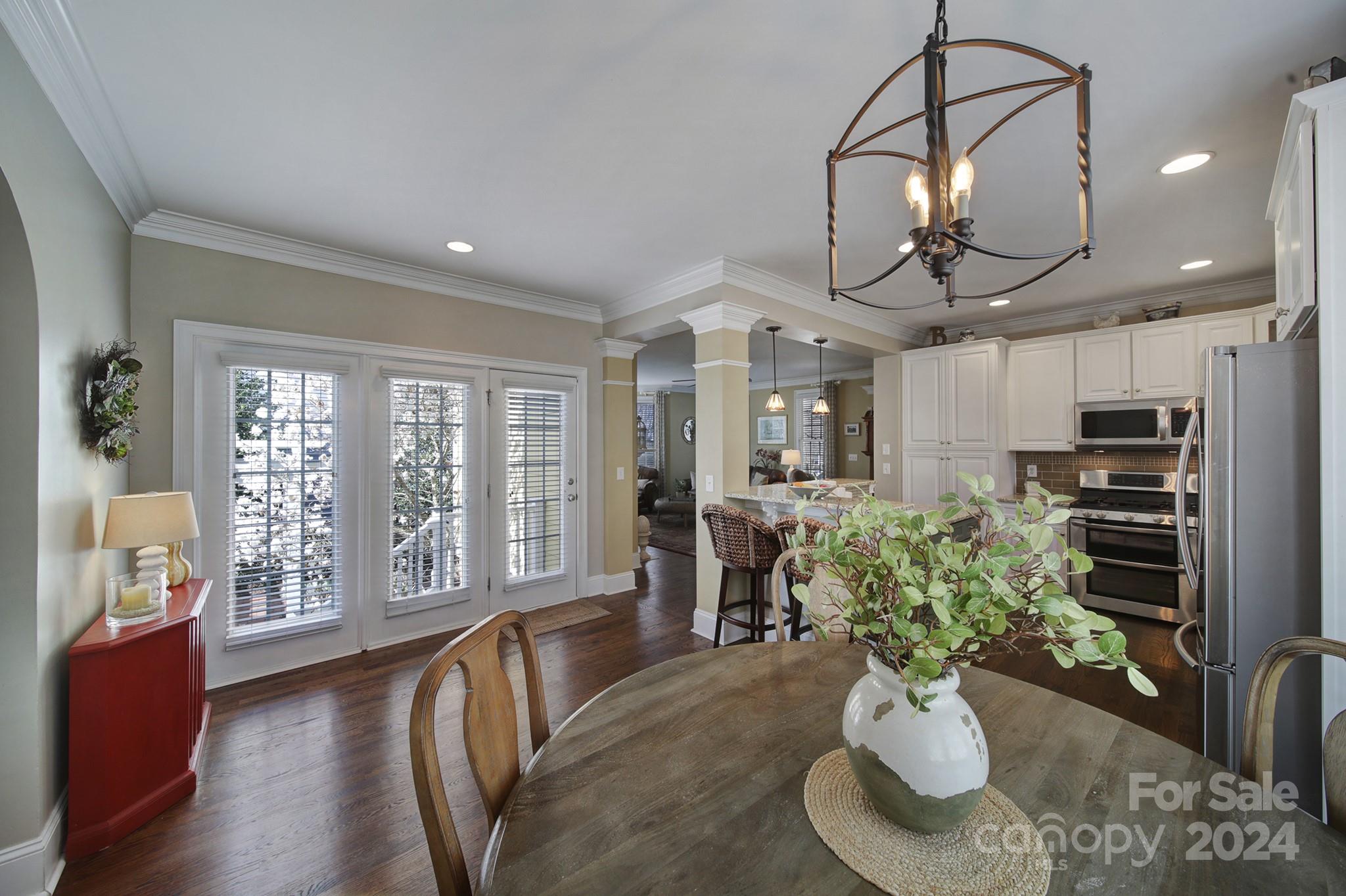724 Shady Grove Crossing Fort Mill, SC 29708 - Photo 19 of 48 a living room with furniture flowerpot and wooden floor