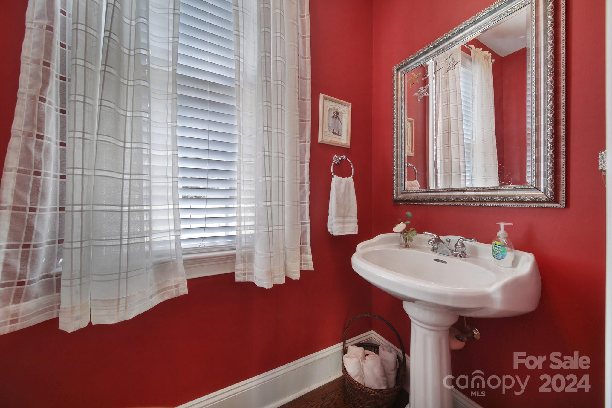 724 Shady Grove Crossing Fort Mill, SC 29708 - Photo 22 of 48 a bathroom with a sink and a mirror