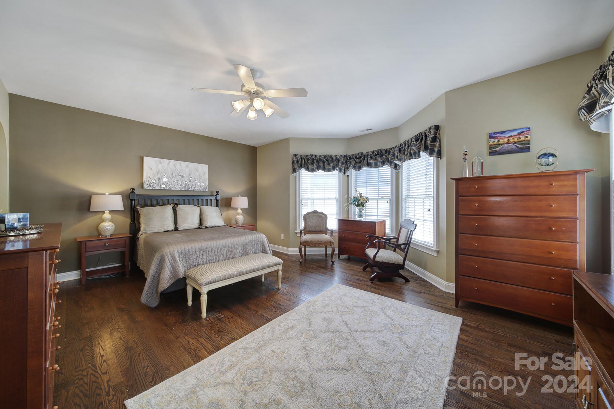 724 Shady Grove Crossing Fort Mill, SC 29708 - Photo 26 of 48 a bedroom with furniture and a wooden floor