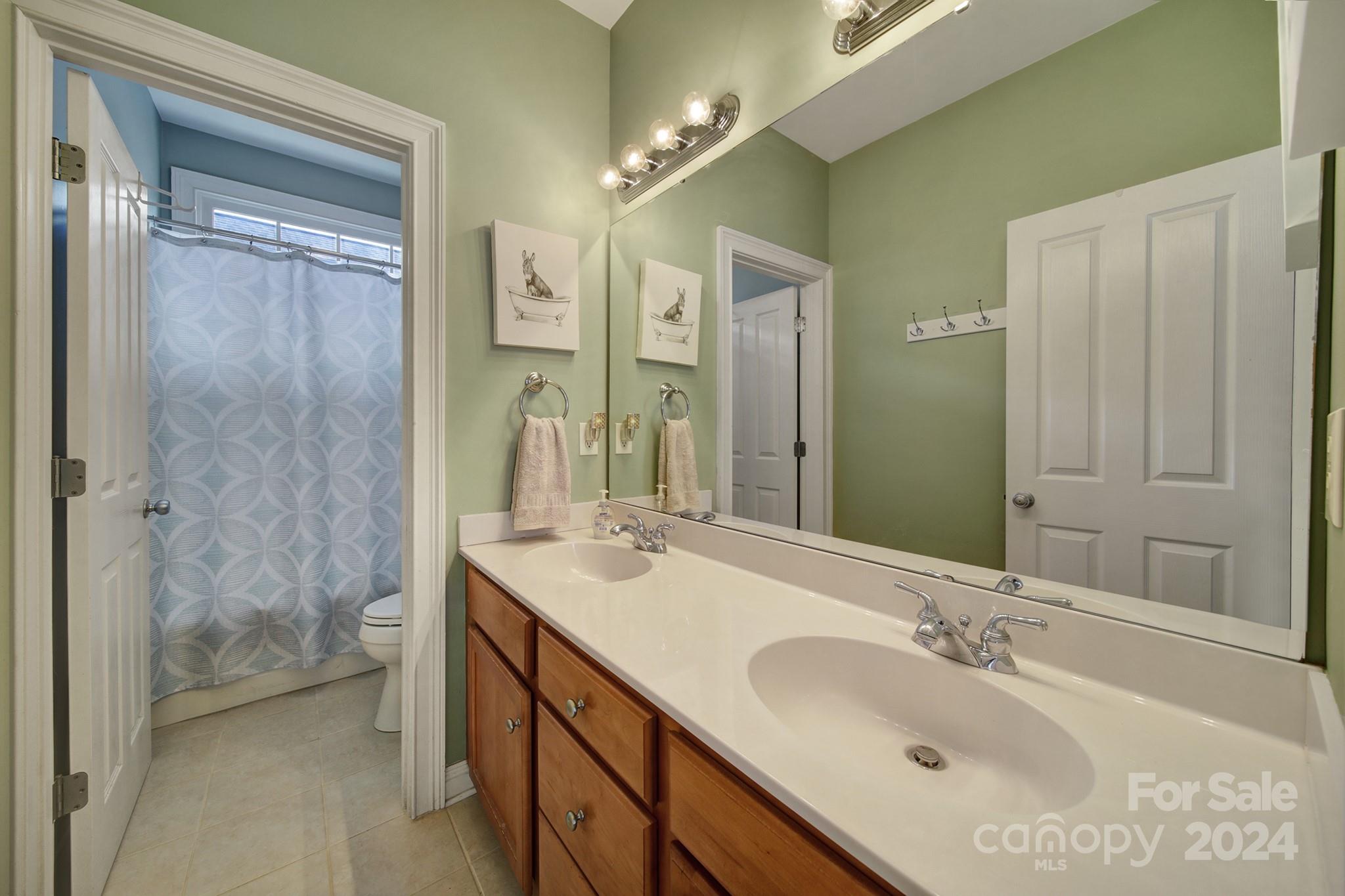724 Shady Grove Crossing Fort Mill, SC 29708 - Photo 31 of 48 a bathroom with a sink double vanity and a mirror