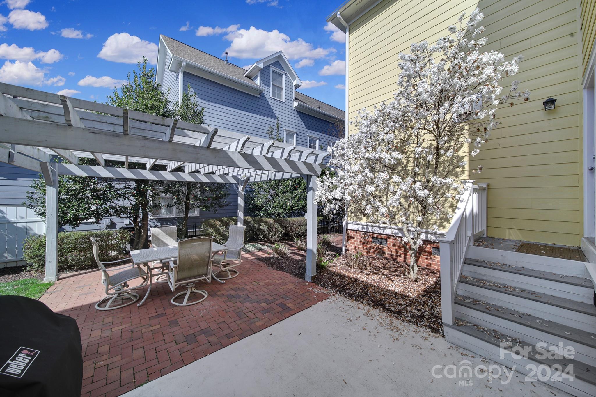 724 Shady Grove Crossing Fort Mill, SC 29708 - Photo 36 of 48 a view of a chairs and table in a patio