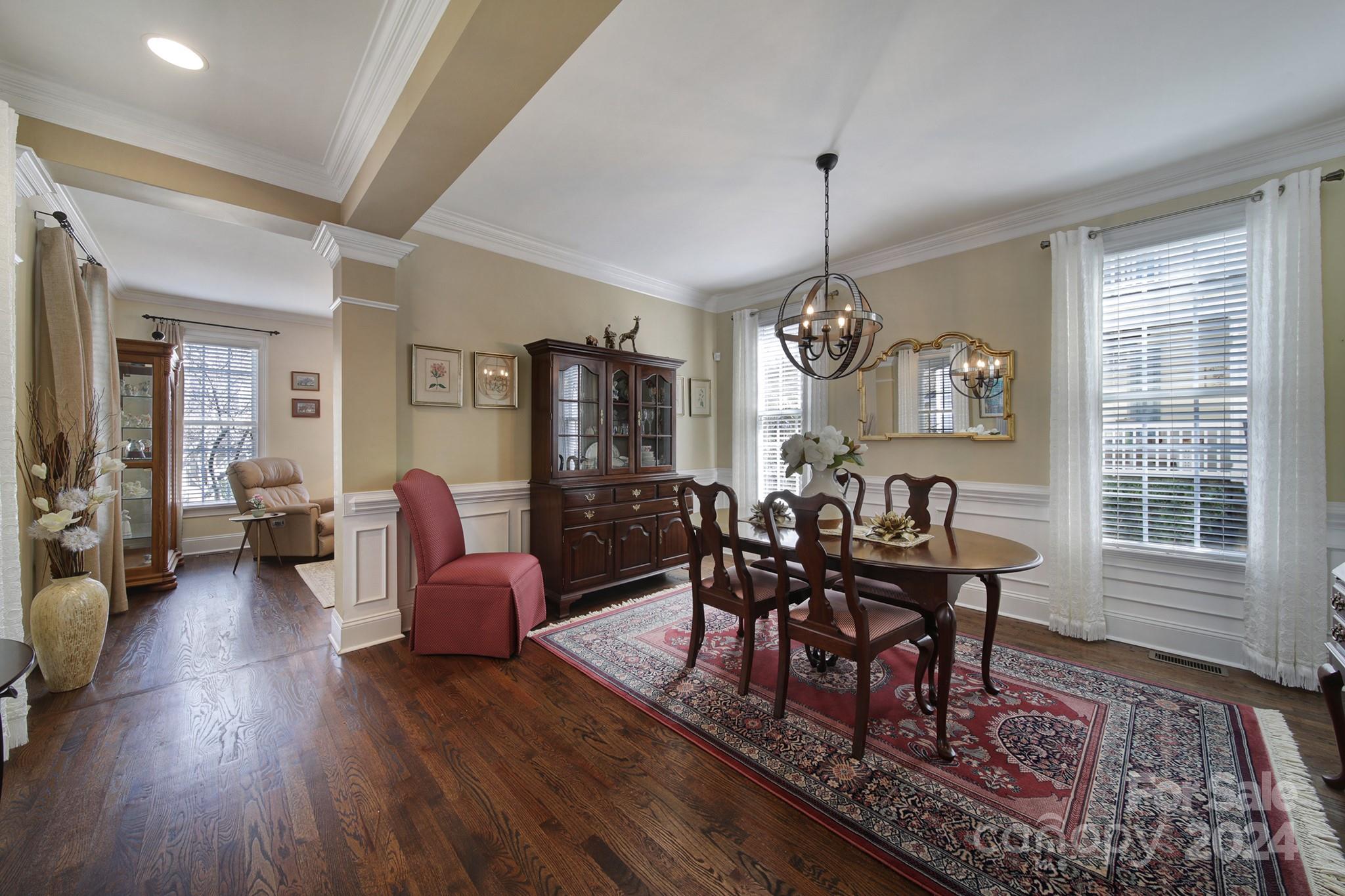 724 Shady Grove Crossing Fort Mill, SC 29708 - Photo 9 of 48 a view of a dining room with furniture window and wooden floor