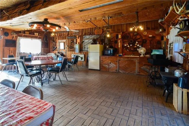 a view of a chairs and tables in a patio