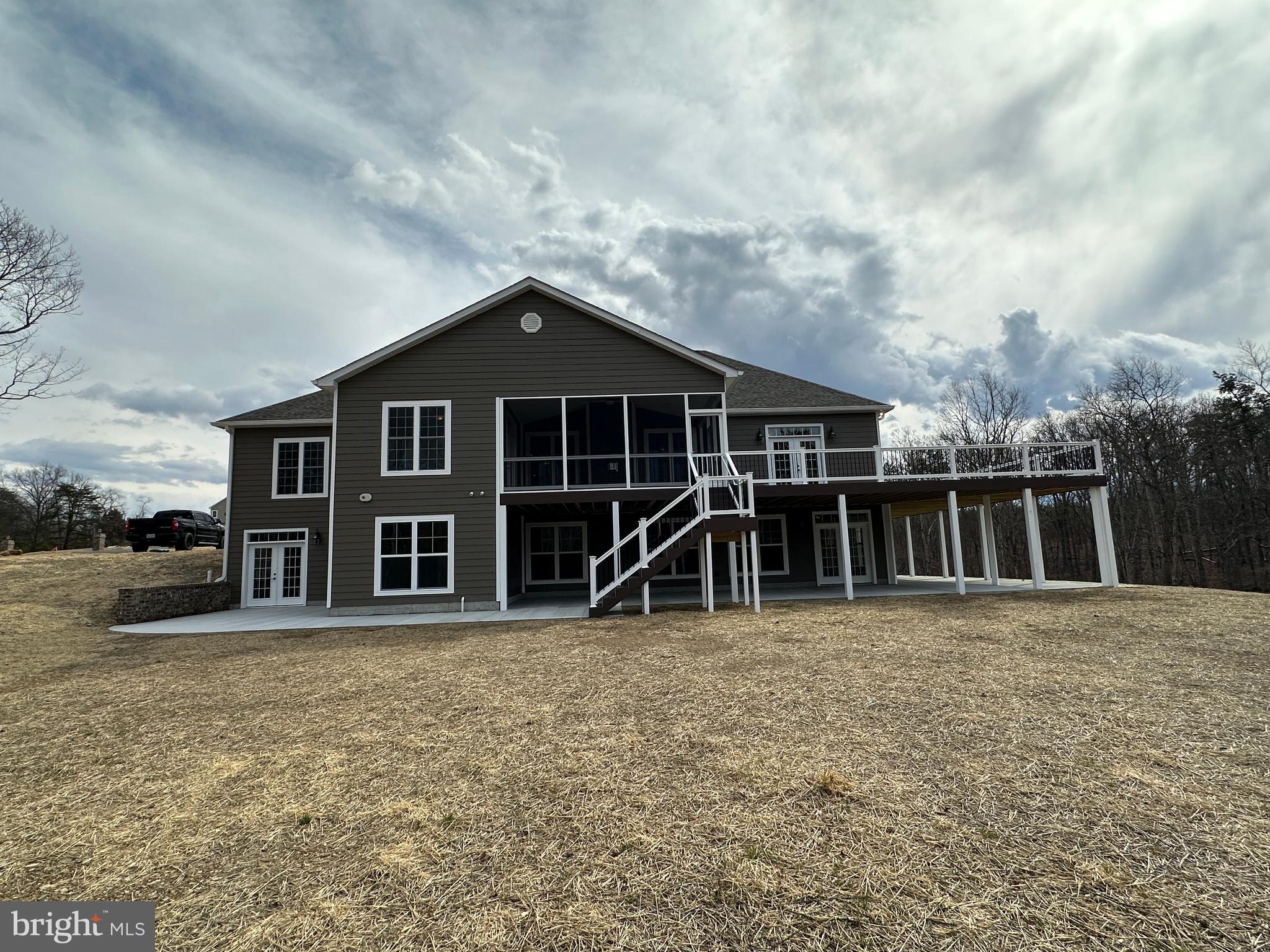 2225 Cedar Grove Road Winchester, VA 22603 - Photo 11 of 48 a view of a house with large windows and a yard