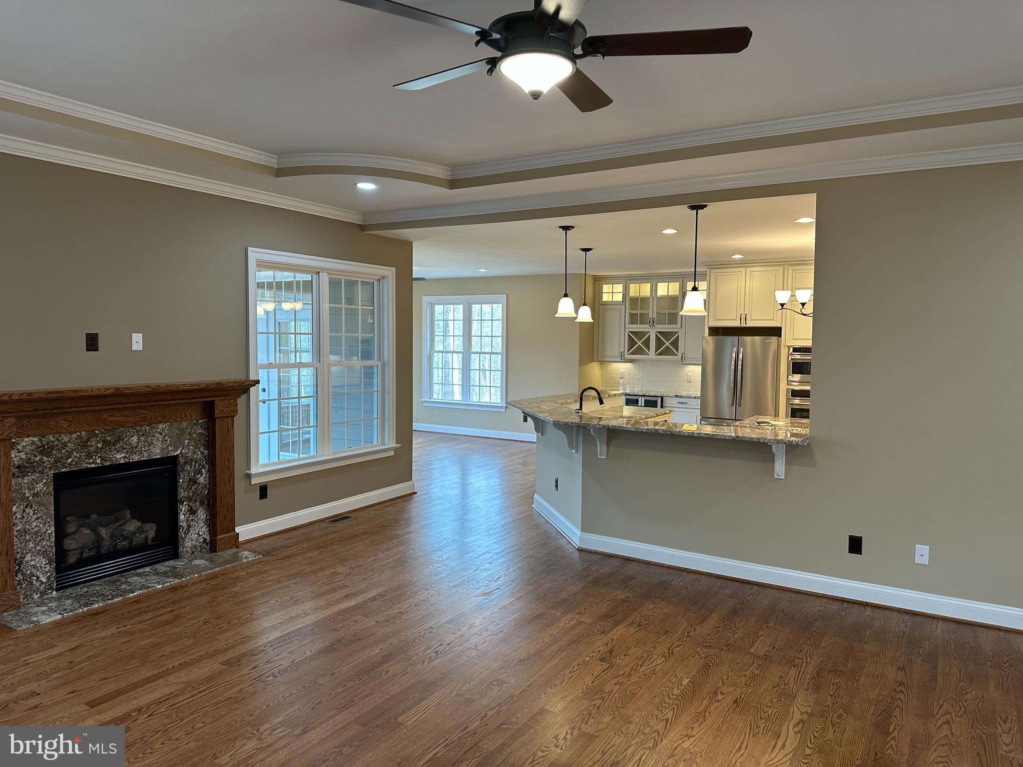 2225 Cedar Grove Road Winchester, VA 22603 - Photo 24 of 48 a view of an empty room with wooden floor and a fireplace