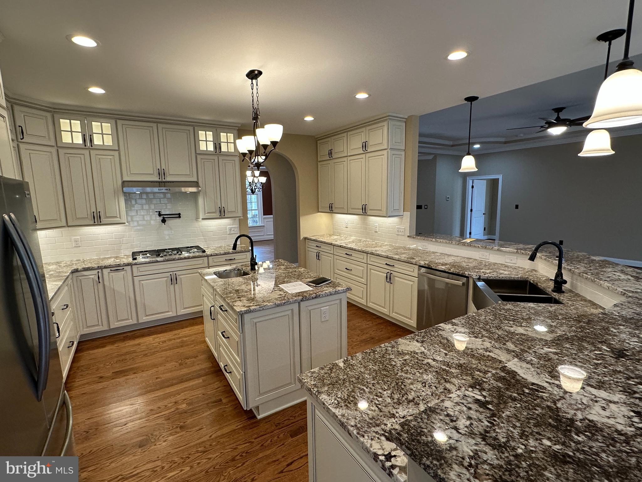 2225 Cedar Grove Road Winchester, VA 22603 - Photo 26 of 48 a kitchen that has a lot of white cabinets and stainless steel appliances