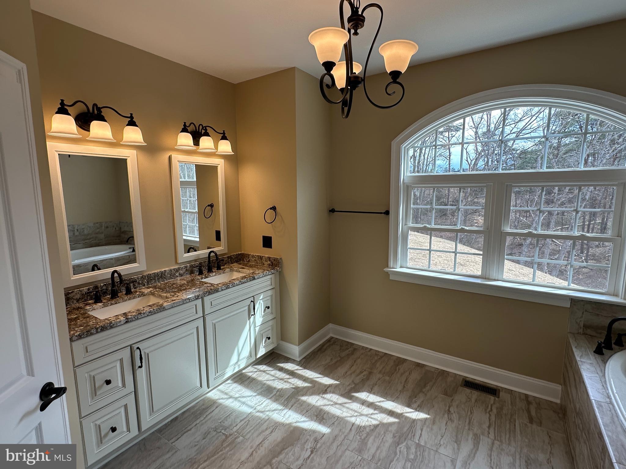 2225 Cedar Grove Road Winchester, VA 22603 - Photo 30 of 48 a bathroom with a sink and a mirror