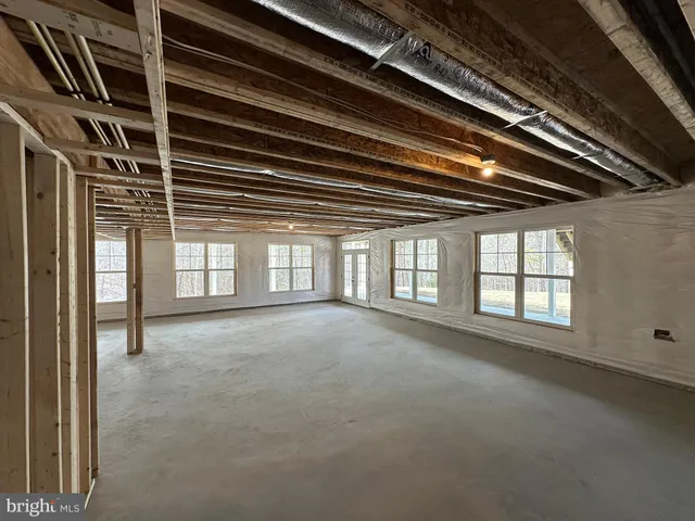 a view of empty room with windows