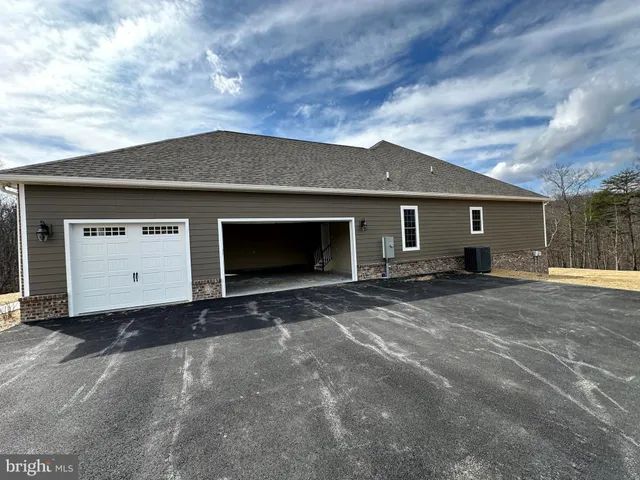 a front view of a house with a garage